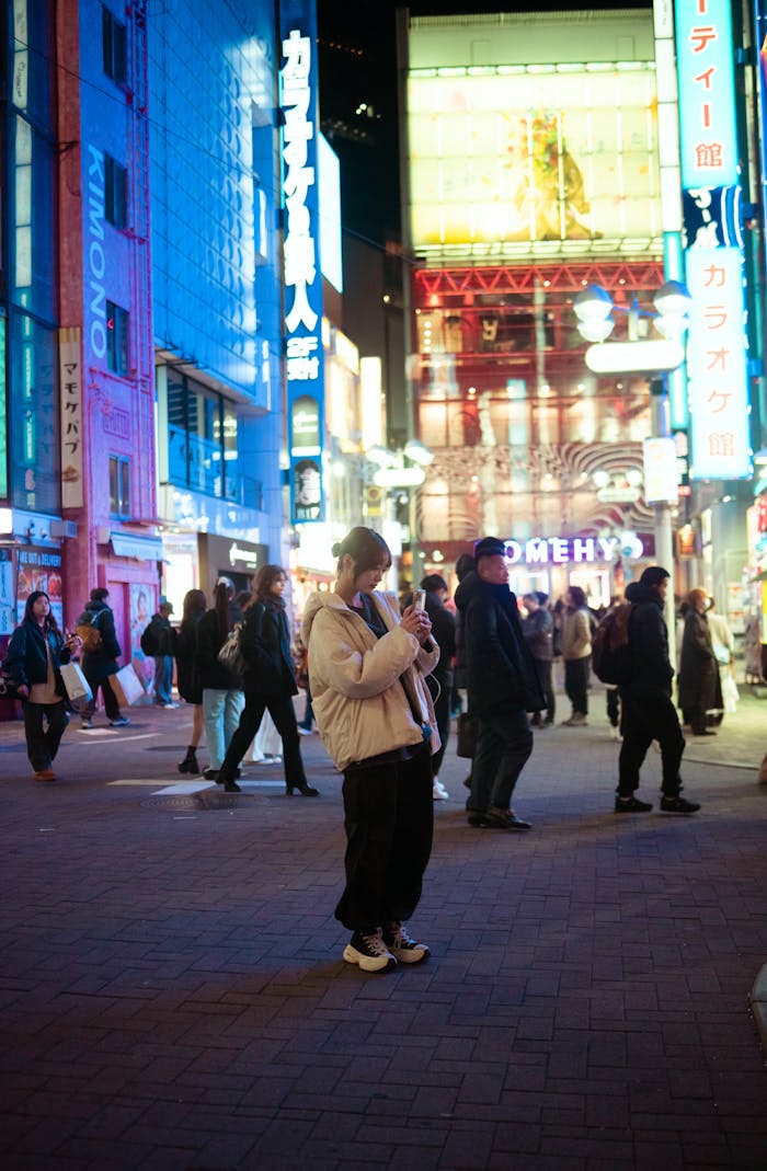 The Art of Drawing Readers In: Your attractive post title goes here Colorful cityscape of Shibuya, Tokyo at night, bustling with people under neon lights.