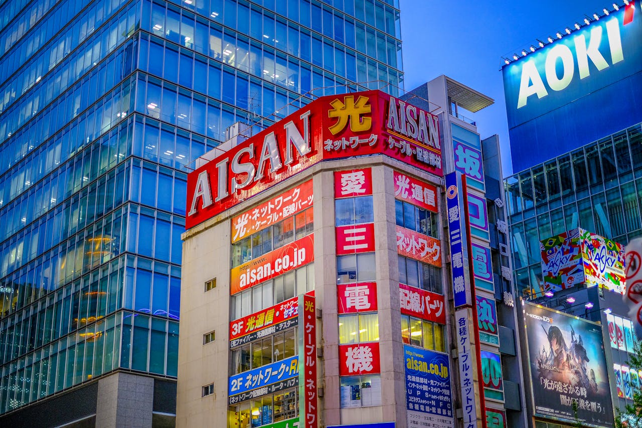 Mastering the First Impression: Your intriguing post title goes here Brightly lit buildings in Shibuya, Japan featuring colorful signage and bustling urban atmosphere.
